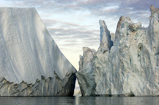20-story high glaciers in Disko Bay, Greenland breaking off from the Greenland Ice Sheet