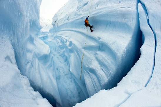 Adam LeWinter ice climbing in Survey Canyon, Greenland