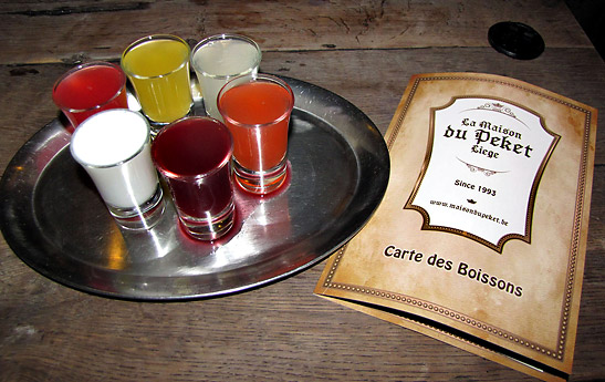 glasses of differenet flavors of Pekets and menu, La Maison du Peket, Liege province