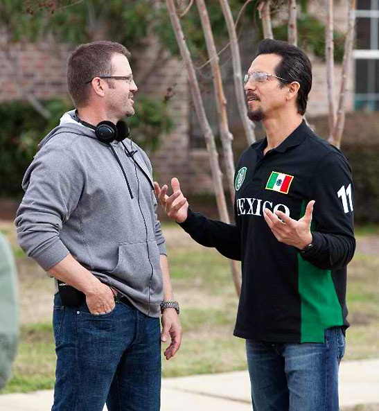 Ric Roman Waugh and Benjamin Bratt discussing a scene from the movie 'Snitch'