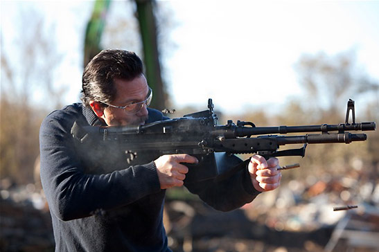Benjamiin Bratt as a drug lord with machine gun in the movie 'Snitch'