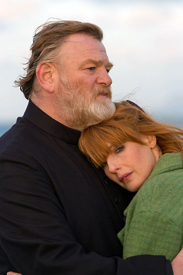 Brendan Gleeson as Father James with Kelly Reilly as daughter Fiona in a scene from the movie 'Calvary'
