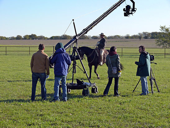 film crew working on a scene from the documentary Buck