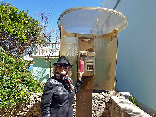 Bev with old-fashioned wall phone