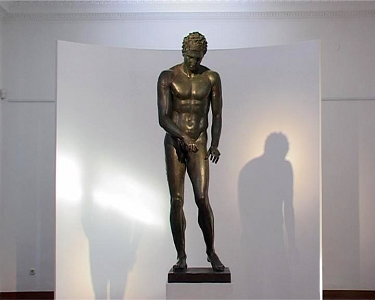 Greek Apoxyomenos statue of an athlete buried in the seabed