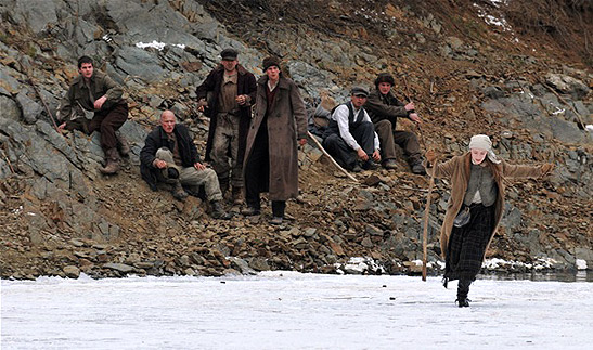Saoirse Ronan leads the way across a frozen lake for her fellow escaped prisoners in a scene from The Way Back