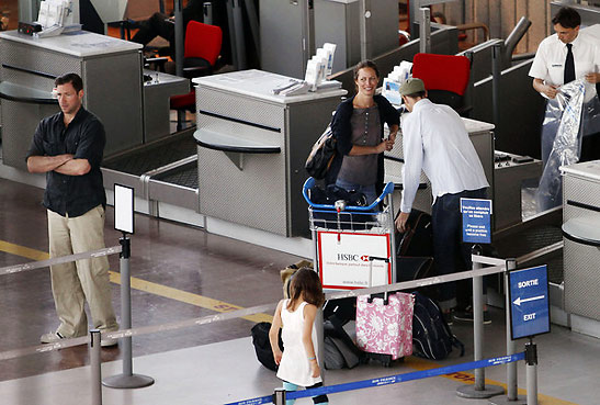 the Burns family at an airport on the way to Nice, France