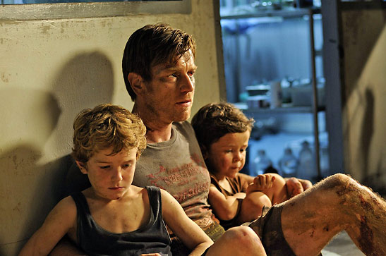 Ewan McGregor with Samuel Joslin and Oakless Pendergast in a scene from The Impossible