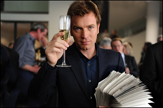 Ewan McGregor with wine and the book The Ghost Writer