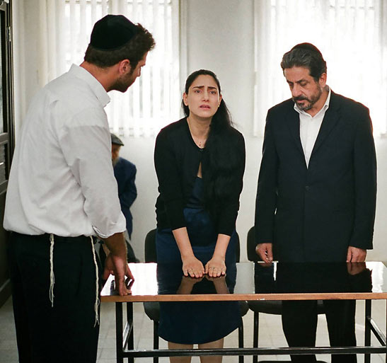 Ronit Elkabetz. Sasson Gabai and Menashe Noy in a scene from GETT