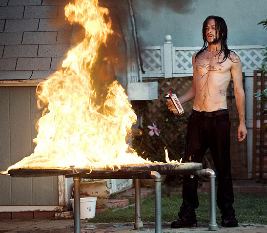 Joseph Gordon-Levitt's character Hesher vandalizing a backyard in a scene from the movie