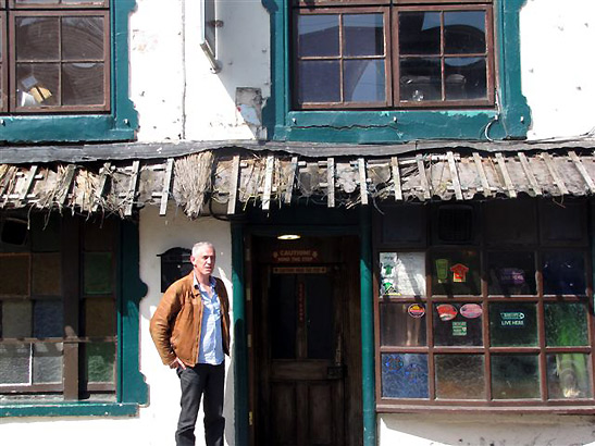 tour guide Will Collins in front of bar