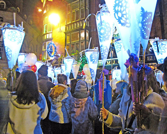 over 1,500 men, women and children carrying toches join the Torch Lit Parade through the streets of Dublin