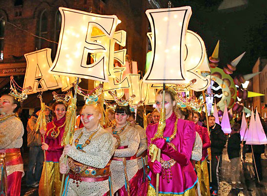 smiling participants of the Torch Lit Parade in Dublin