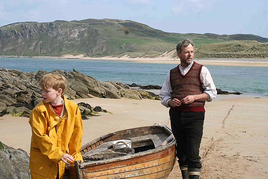 John Bell and Aidan Quinn in a beach scene from the film A Shine of Rainbows