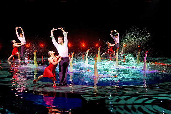 water dance scene amidst a kaleidoscope of colored lights from La Reve at the Wynn Hotel, Las Vegas