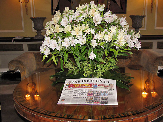 newspaper and flowers on table at the Merrion Hotel lobby, Dublin, Ireland