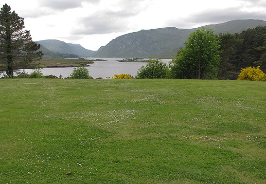 rolling hillsides overlooking lake and mountains, Glenveagh National Park, Ireland