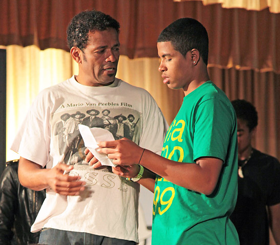 Mario Van Peebles rehearsing a scene with his son Mandela in the film We The Party