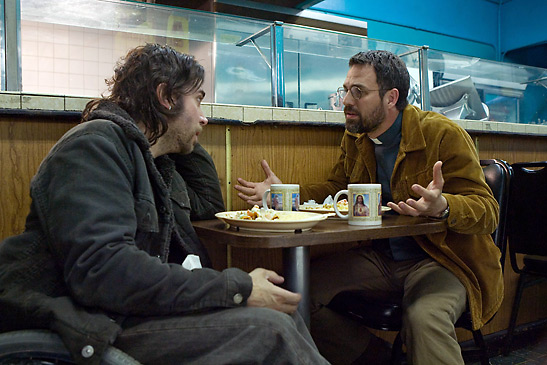 Mark Ruffalo as Father Joe and Christopher Thornton as Delicious D in a coffee shop scene from the movie Delicious D