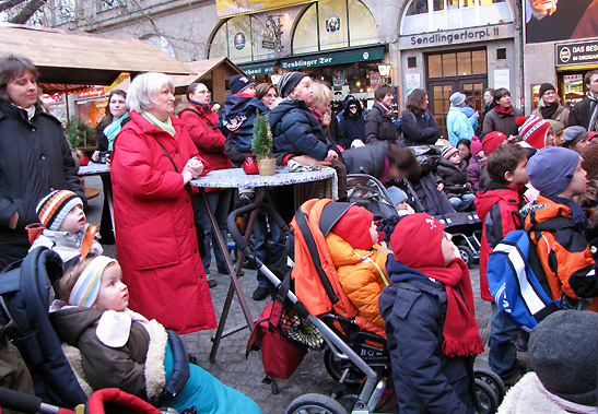 crowd listening to an alpine concert at the Munich town hall