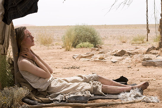 Irena (Saoirse Ronan resting under a tree in a scene from The Way Back