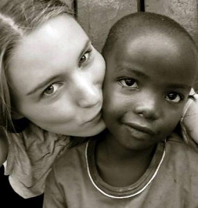 Rooney Mara with a child in East Africa