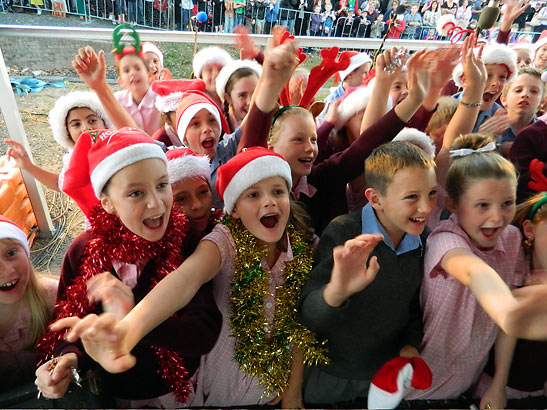 children at the mining town of of Kalgoorlie welcome Santa and Brian McFadden