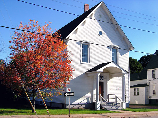 maple tree and house in early fall, New Brunswick