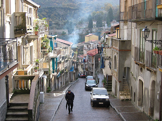 view along a narrow street of a Calabrian town after a rainshower, southern Italy