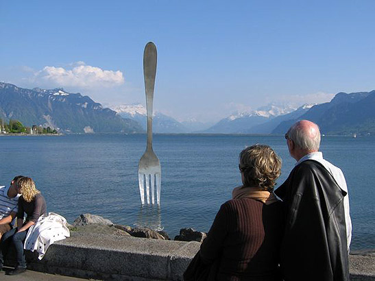 sculpture of a huge fork embedded in lake bed, Lake Geneva, Montreux