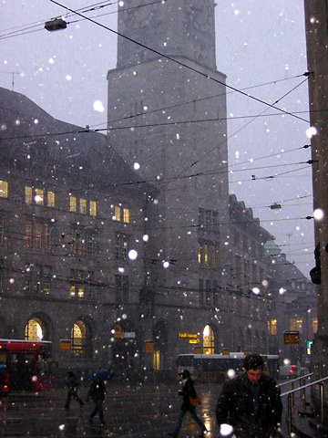train station in St. Gallen during a rush hour snow fall