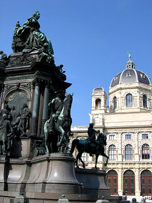 a statue of Hapsburg Queen Maria Theresa with the Museum of Fine Arts in the background