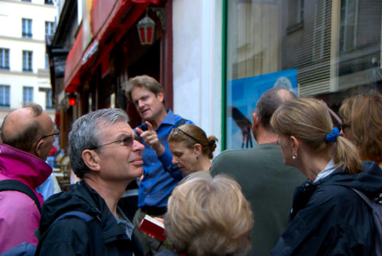 tourists with guide at a Paris Walking Tour