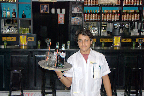 waiter serving drinks at the Cuban La Bodequito del Medio, Fifth Avenue, Playa del Carmen