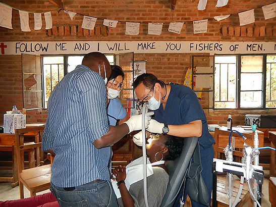 Dr. Lee performs a procedure on a Rwandan woman