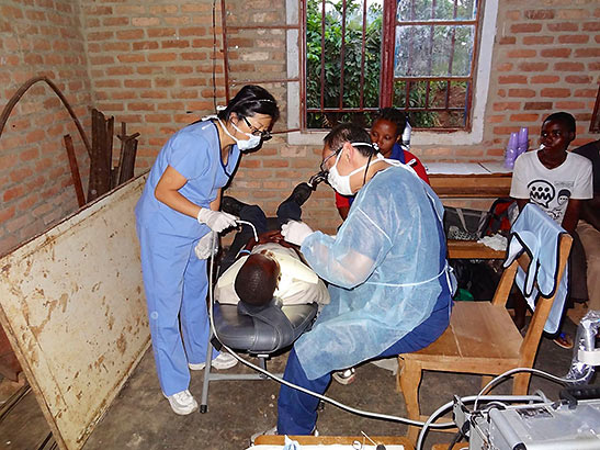 Dr. Lee and his dental staff treating a boy