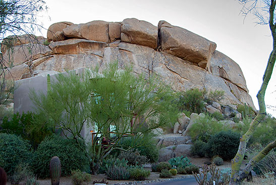 another group of massive boulders overlooking a roadway at The Boulders REsort and Spa
