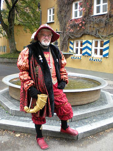 Fuggerei guide posing in medieval attire