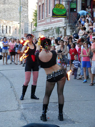 dancers with flaming hoops in the Artrageous Parade