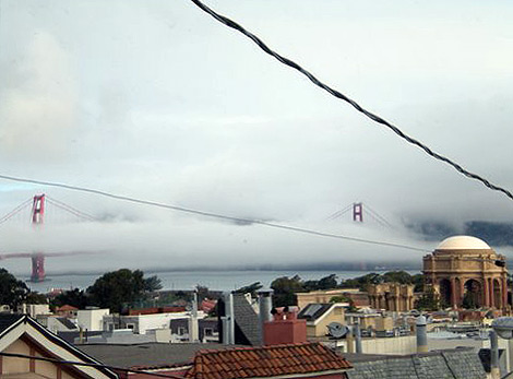 a view of the Golden Gate Bridge shrouded in fog, San Francisco