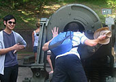 visitors observing artillery piece on Corregidor Island