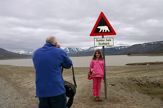 picture taking at a polar bear warning sign, Longyearbyen, Norway