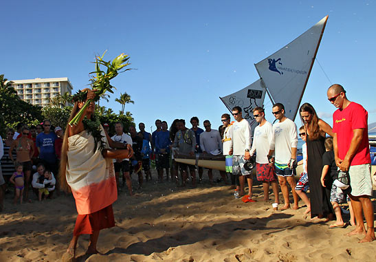 Hawaiian Cultural Practitioner giving a traditional blessing to canoe crews and spectators