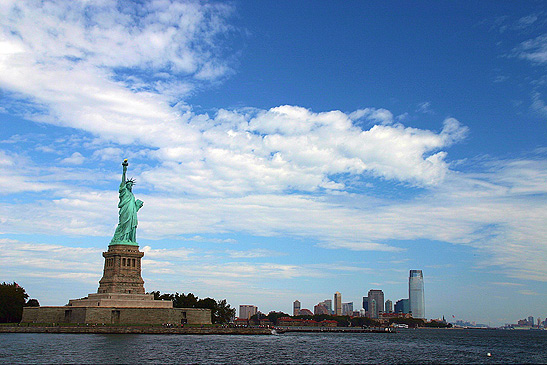 the Statue of Liberty with Manhattan skyline in the background