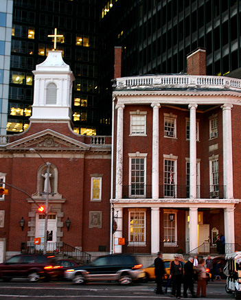 older brick church surrounded by skyscrapers, downtown Manhattan