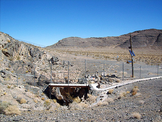 the home of the Devil's Hole Pupfish: a spring-fed limestone hole protected by a chain fence