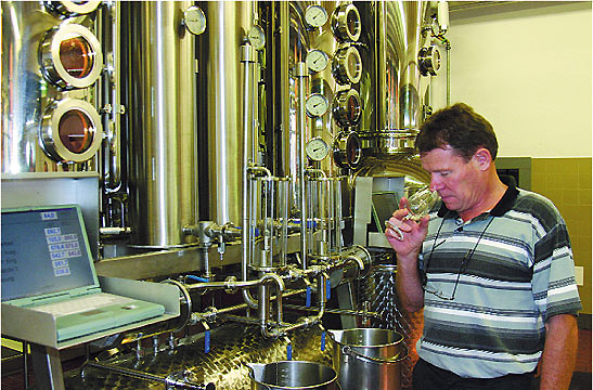 winemaker Arnold Dettling sampling kirsch, Switzerland