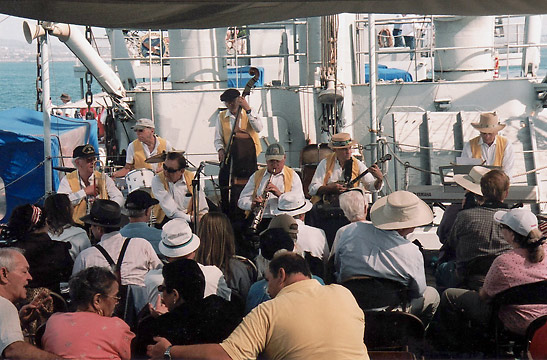 a band playing on board the SS Lane Victory