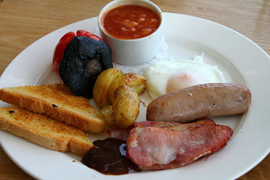 full Welsh Breakfast of eggs, sausage, beans, back bacon, grilled tomatoes and mushrooms, potatoes, fried bread and laverbread